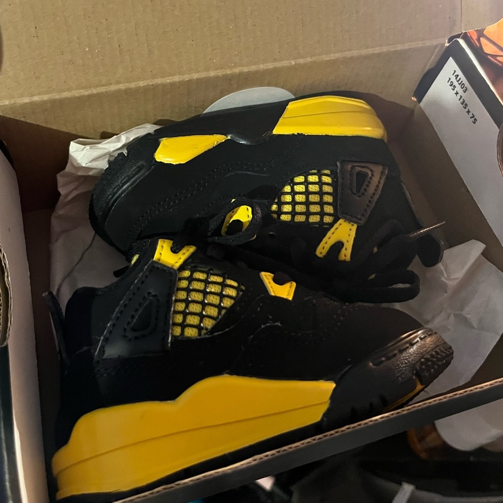 Jordan 4s yellow thunder. size 4c new in box.